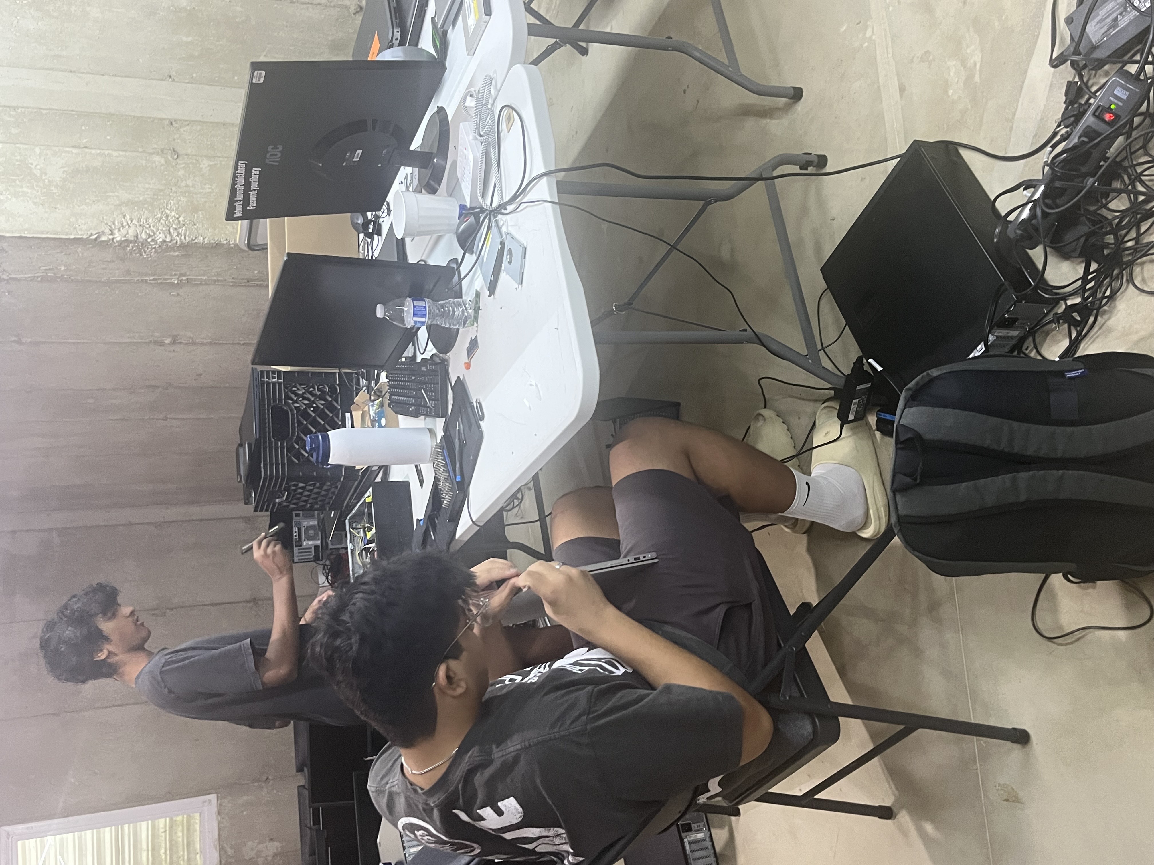 Ishaan and Nimai working on a computer